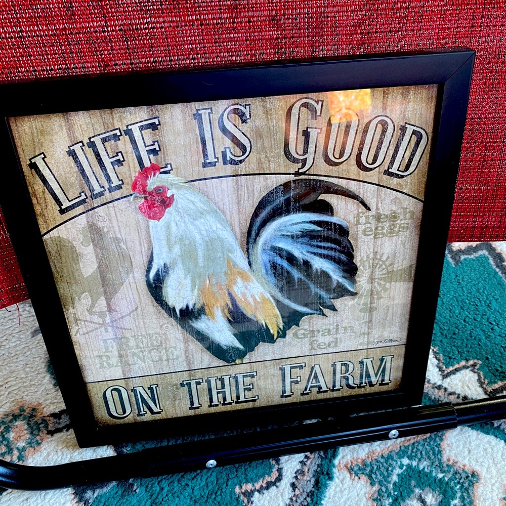 Framed rooster wall decoration.